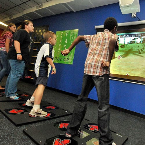 Kids playing with Game Pad Exergame Game Pad